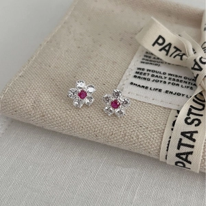 Sparkling floral stud earrings with red and clear crystals in minimalist silver setting