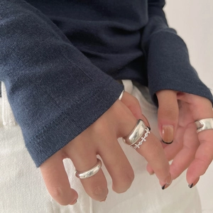 Close-up of S925 sterling silver cross rings stacked on finger with minimalist design