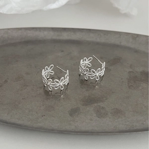 Elegant S925 sterling silver lace flower stud earrings with a hollow floral hoop design