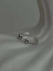 Macro detail of S925 sterling silver stamp on the vintage fleur-de-lis open ring band