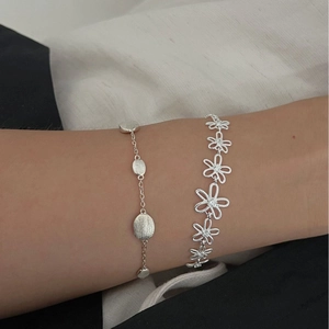 Elegant S925 silver jewelry set featuring minimalist brushed metal and hollow flower bracelets