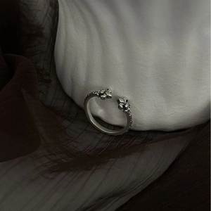 Vintage silver open ring with cross flower engraving and textured finish on white stone