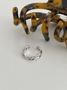 Macro shot of vintage S925 silver pig nose open ring with an adjustable retro texture