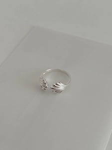 Detail shot of the S925 hallmark on silver shell ring with high polish finish