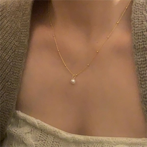 S925 sterling silver necklace with a single natural freshwater pearl on a gold bead chain