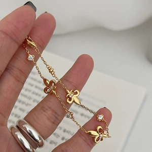 French vintage gold bracelet with iris charms and zircons on a delicate link chain