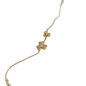 Exquisite gold clover flower bracelet with brushed texture and sparkling zircon inlay