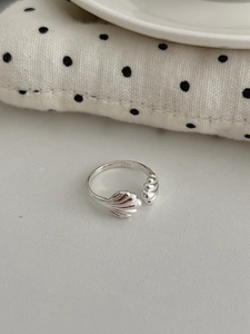 Detail of S925 sterling silver shell ring with scalloped texture and adjustable band