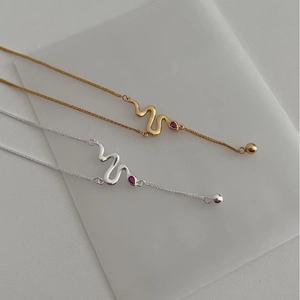 Minimalist S925 sterling silver snake pendant necklace with red crystals in gold and silver