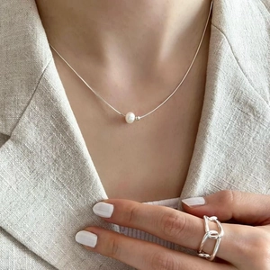 Elegant natural pearl pendant on silver snake chain necklace with matching link ring