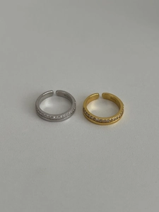 Detail of S925 sterling silver stamp and micro-paved zircon on thin open rings