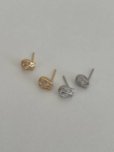 Macro view of S925 silver tulip earrings with teardrop cubic zirconia in gold and silver