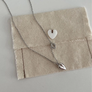 Minimalist S925 sterling silver double heart pendant necklace with a natural linen pouch