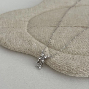 S925 sterling silver butterfly necklace featuring marquise cut diamonds on linen display