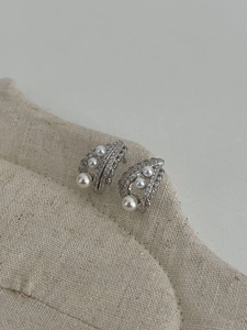 Detailed close-up of S925 silver lace earrings with sparkling rhinestones and white pearls