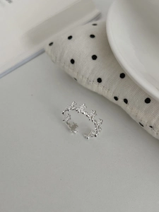 Detailed macro shot of S925 sterling silver ring featuring a fleur-de-lis crown design