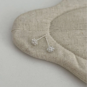 Minimalist S925 sterling silver pine cone stud earrings with a matte textured finish