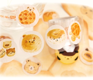 Detailed close-up of cute animal and pastry themed PET decorative tape for journaling