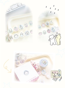 Close-up of cute cartoon cat and rabbit round stickers on various everyday objects