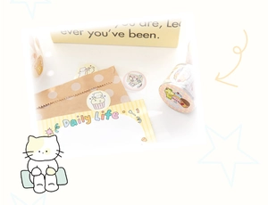 Detailed view of cute cat-themed washi tape rolls, stickers, and mini paper bags
