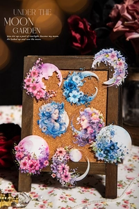 Artistic detail of Under the Moon Garden PET stickers featuring floral moon and moon portraits