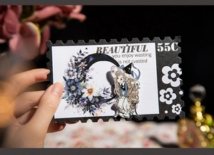 Detail of vintage stamp PET sticker featuring purple floral moon and wizard girl illustration