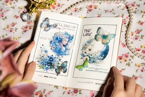 Close-up of vintage Moonlight Garden stickers with blue hair girl and floral butterfly theme