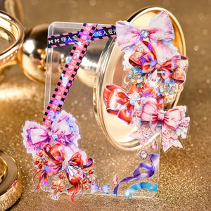 Sparkling bow theme PET tape on a DIY acrylic photocard holder with laser holographic effect