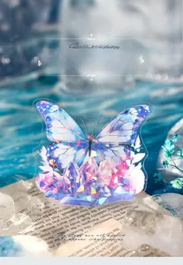 Detail of 3D crystal butterfly sticker with iridescent shell light finish on a book