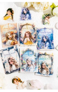 Flat lay of fantasy girl themed PET stickers on white textured cloth with floral accents