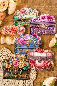 Detailed close-up of vintage floral box PET stickers on rustic burlap background