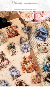 Detail of vintage PET stickers featuring antique typewriter and gramophone on craft paper