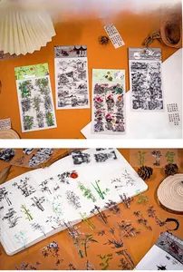 Close-up of ink wash style PET stickers featuring Chinese landscapes and lotus designs