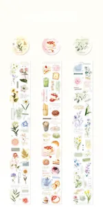 Detail of PET decorative tapes featuring botanical and dessert illustrations for journaling