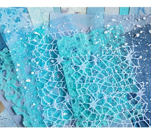 Makroaufnahme von Spitzennetz und Cyan-Faser-Dekorpapier für DIY-Scrapbooking-Projekte