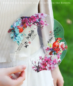 Close-up of a PET sticker with traditional Chinese floral and bird patterns in shell light