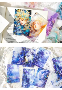 Detail showing laser glitter art cards with fantasy forest themes on vintage book pages