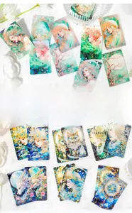 Macro view of fantasy theme illustration cards with laser sparkling finish for scrapbooking