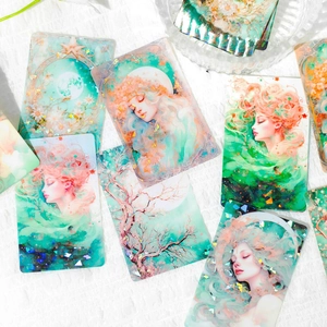 Artistic fairy-themed decorative cards with holographic details and natural elements