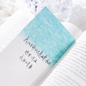 Artistic paper bookmark with blue watercolor design and poetic quote for journaling