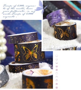 Macro detail of vintage cosmic washi tape featuring galaxy patterns and gold foil butterflies