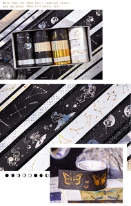 Macro view of vintage galaxy washi tape set featuring gold foil space and butterfly motifs