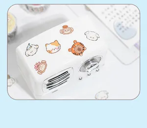 Detail showing cute animal stickers applied on a vintage radio prop for decoration
