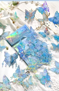 Detail of 30pcs blue butterfly stickers with holographic effect on lace background