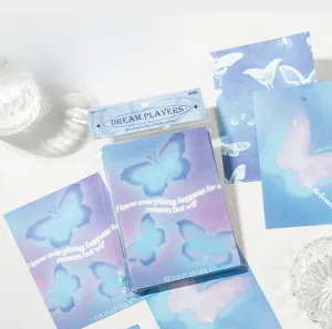 Detailed macro view of Dream Players butterfly scrapbooking papers with blue gradient theme
