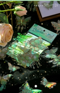Macro shot of 30pcs holographic laser butterfly stickers with gold edges for journaling