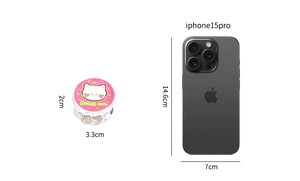 Detail view of Cute Honey Cat Washi Tape roll beside iPhone for size comparison