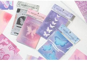 Detailed view of Dream Players butterfly scrapbooking paper set with purple aesthetic