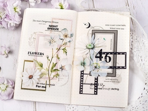 Close-up of floral PET stickers on a dotted notebook with elegant flower motifs