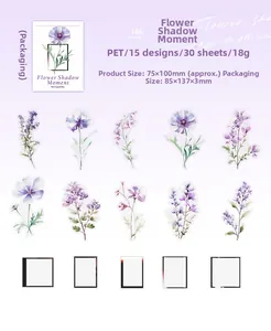 Macro detail of PET floral stickers in purple shades and film frames for DIY scrapbooking